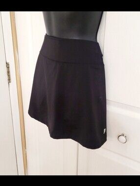 Prince black tennis skirt with built-in shorts. Size M